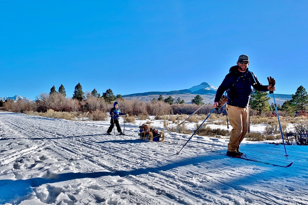 Family cross country skiing at the Busted Arm Draw trails near Norwood Colorado